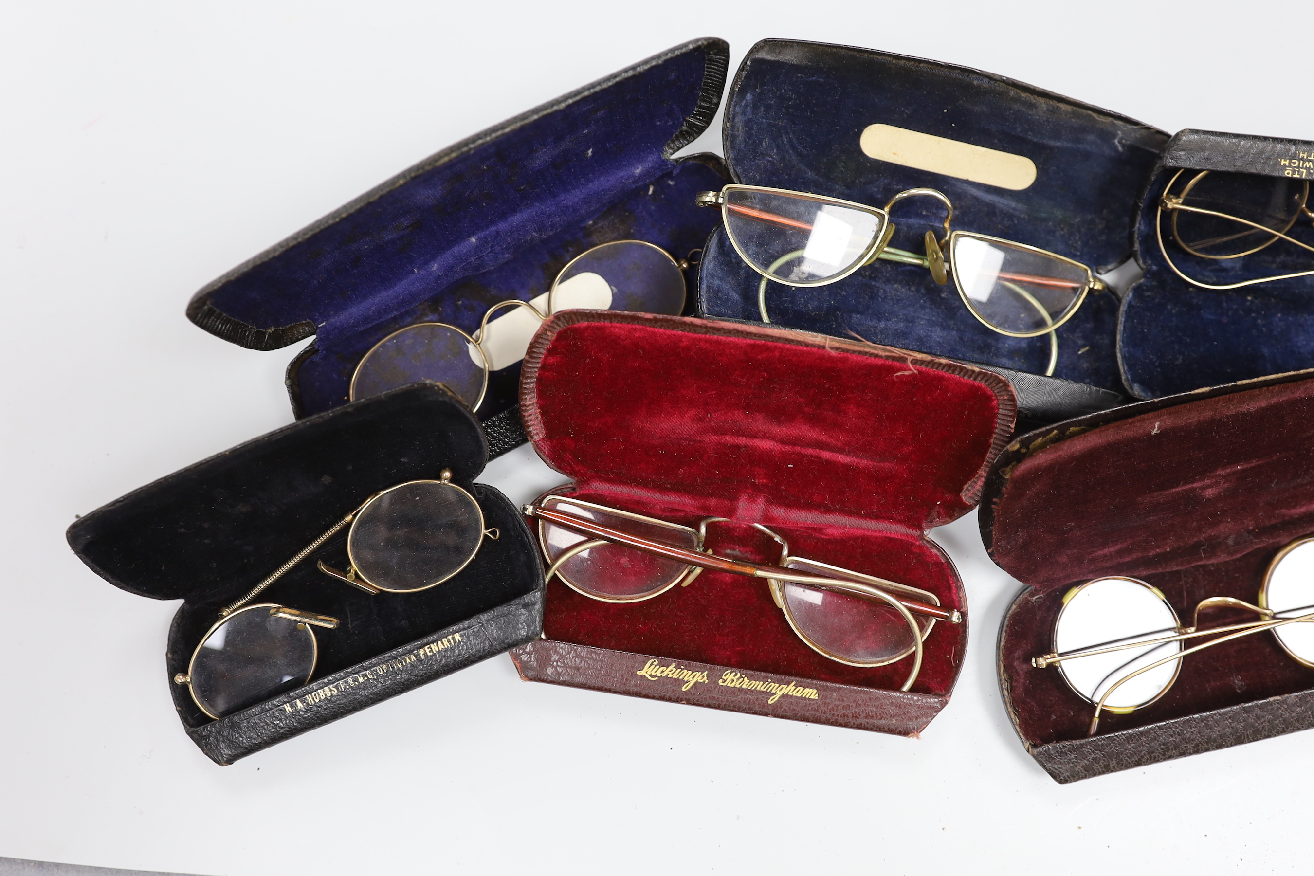 A quantity of spectacles and cases